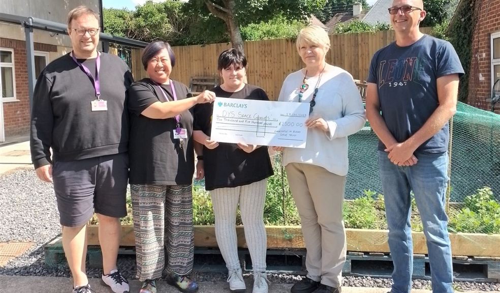 Space Youth Services receiving a cheque for garden enhancements in Barnstaple