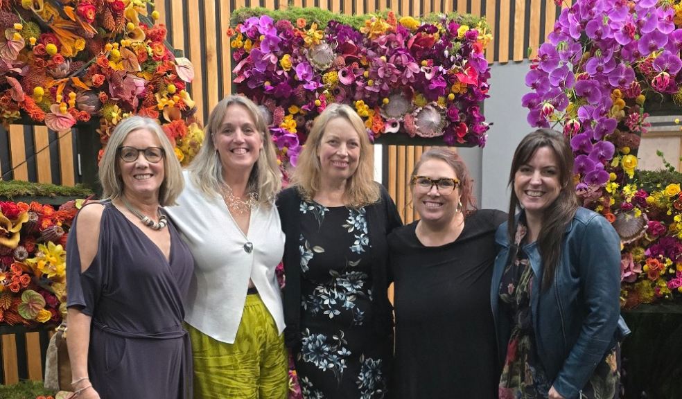 Tina Parkes, director of the British Academy of Floral Art teaching school (centre) with the successful students.