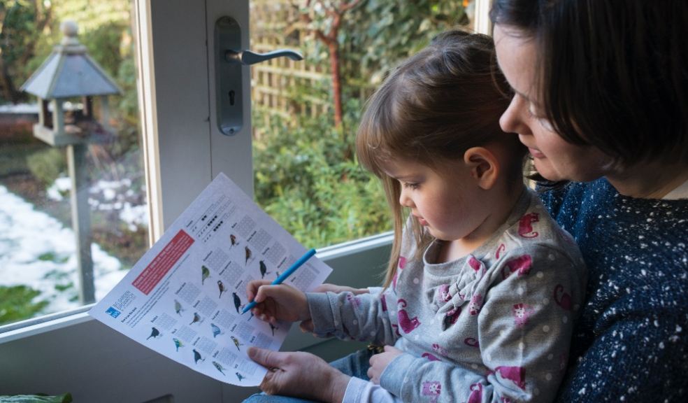 Mother and her daughter counting birds in their garden. Photo: Eleanor Bentall (rspb-images.com)