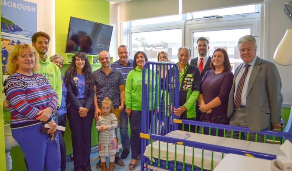 NHS staff with Care for Kids trustees, volunteers and families in the Caroline Thorpe Ward, the children's ward in North Devon District Hospital, Barnstaple, in 2018