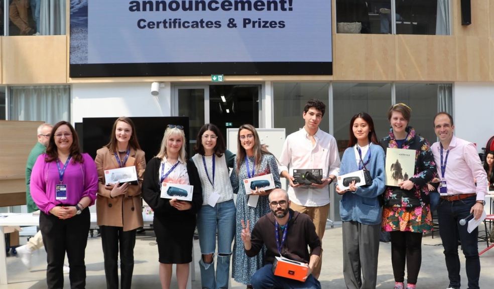 Group of young people holding prizes