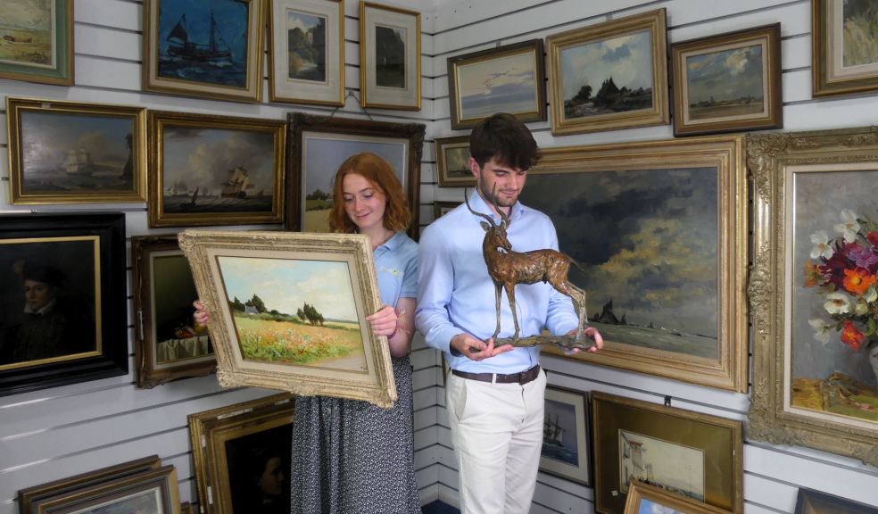 Auctioneers Mary Chilcott and Barnaby Willis with Captain Campbell’s Collection Auctioneers Mary Chilcott and Barnaby Willis with Captain Campbell’s Collection
