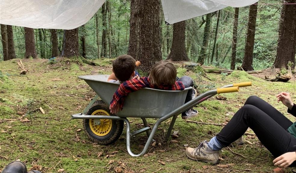 Children in wheelbarrow Children in wheelbarrow