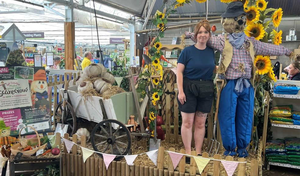 Woman with a scarecrow at Otter Gaden Centres