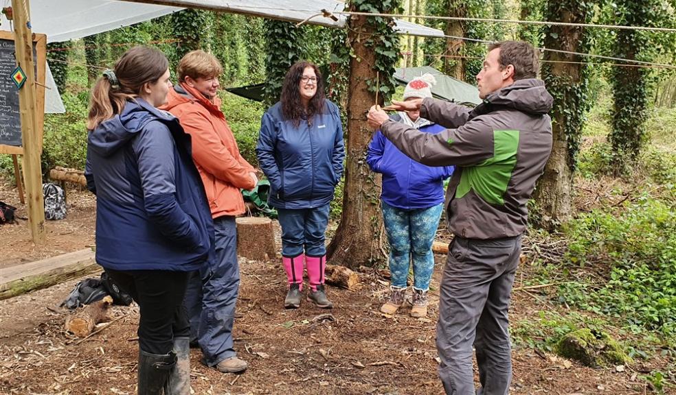 Ali Taylor with Learning Beyond the Classroom delegates Group in woodland