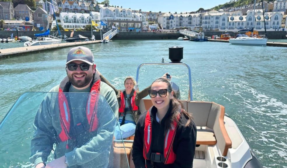 A family on a boat leaving harbour