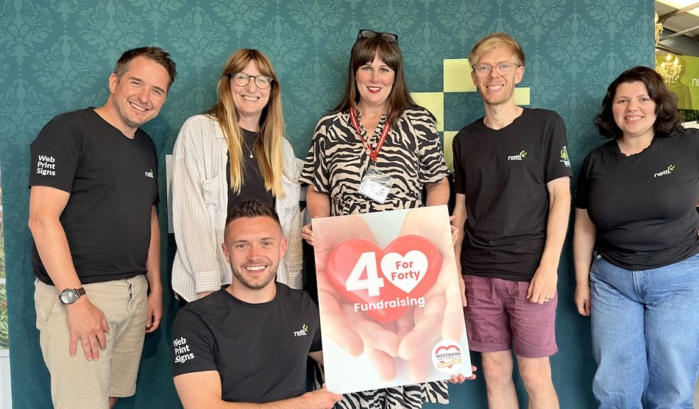 Westbank's Katie Elliott, centre, with the supportive team at Nettl Westbank's Katie Elliott, centre, with the supportive team at Nettl