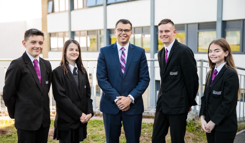 Headteacher Lee Sargeant with students from All Saints Academy