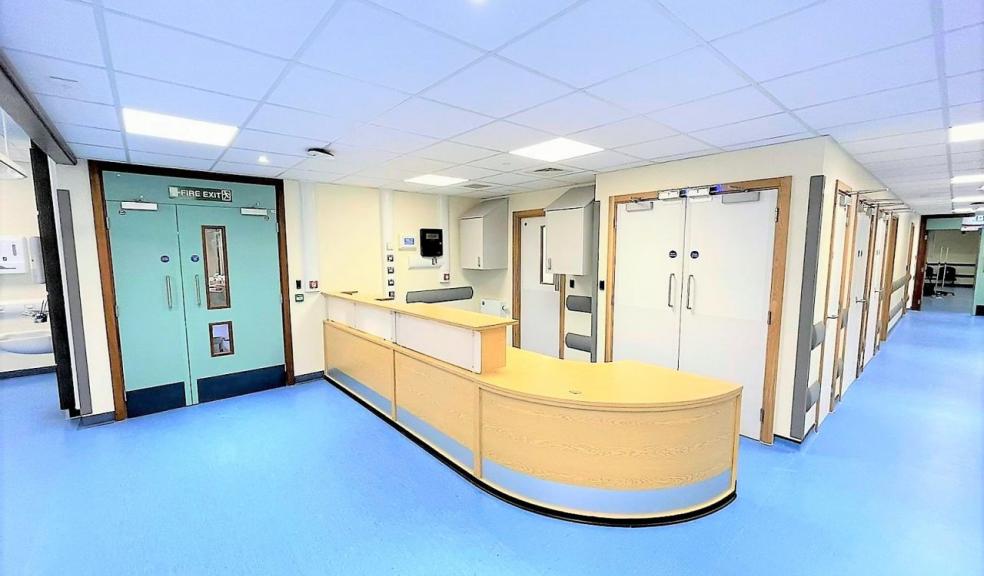 Hospital corridor with blue floor.  