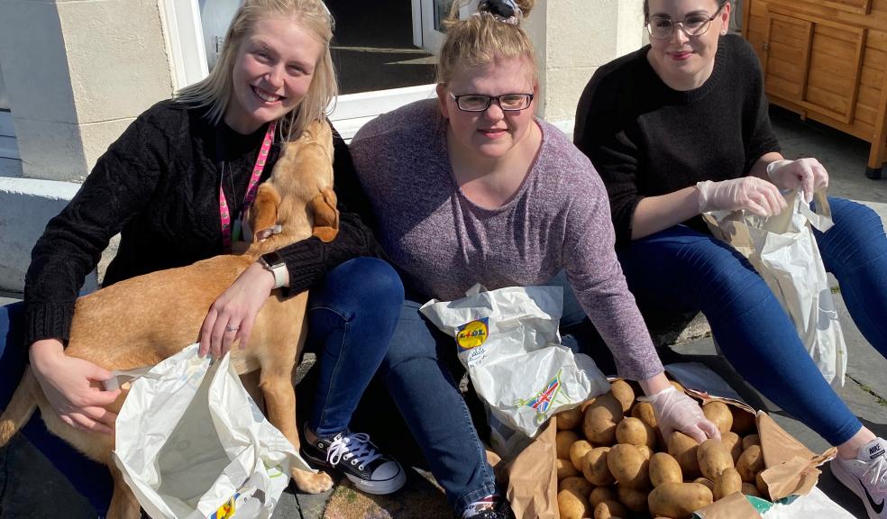 (l to r) Member of staff, Caileen Stevens with the puppy Daisy, resident at Bull Point Hannah Funnell and member of staff Sacha Harris.