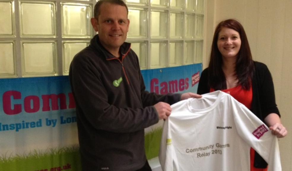 Charlotte Keene receiving commemorative jersey from County Sport Partnership (Active Devon) Chief Executive, Matt Evans