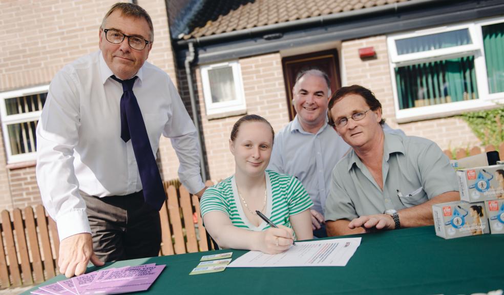 Leader of the Council Tudor Evans and Councillor Penberthy join Christopher Fry from Plympton and his daughter Natasha Fry from Stonehouse as they sign up to the Plymouth Energy Community switching scheme