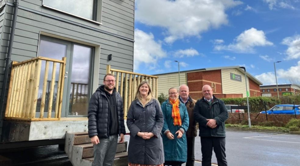 Cllr Dan Ledger, Jo Garfoot, Cllr Eleanor Rylance, Cllr Paul Arnott and Paul Lees stood by the eddc modular house.