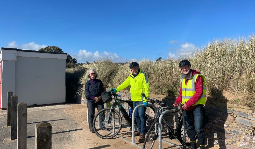 Councillors Marianne Rixson, Olly Davey, and Geoff Jung next to the new bike parking spaces on Exmouth Seafront.