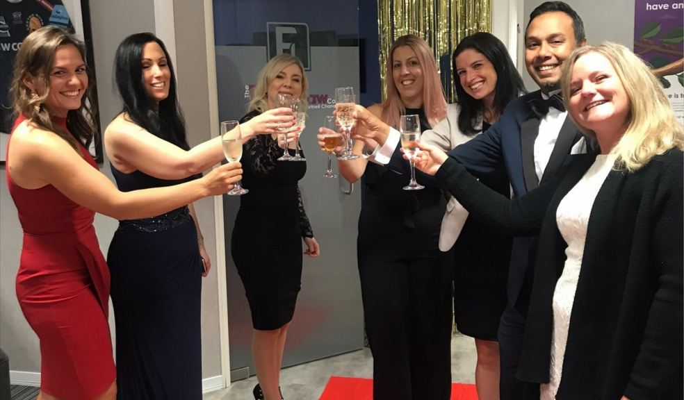 Group of lawyers toasting with a glass of fizz