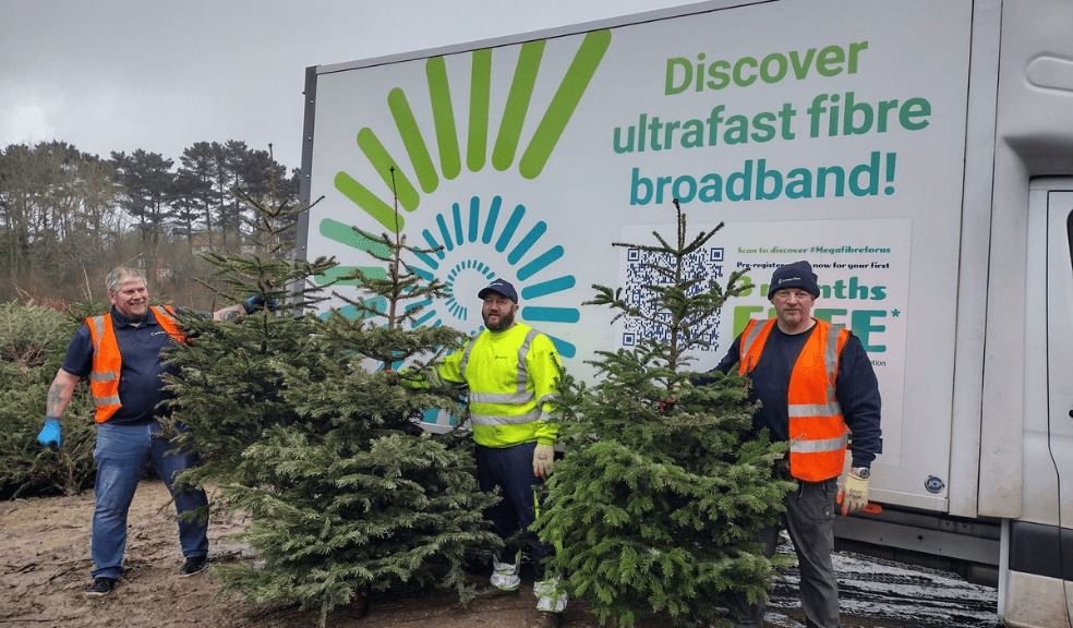 Jurassic Fibre Hospiscare employees holding their Xmas trees