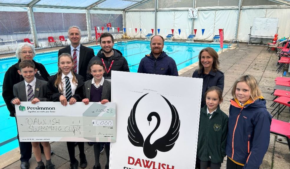 The cheque presentation took place at the Club’s pool, with club members and volunteers, as well as staff from Trinity School.