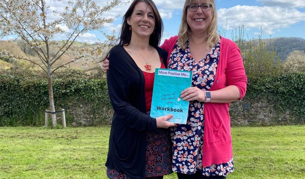 Two women with a book