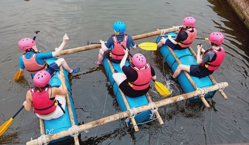Devon Young Carers Movement Group - 6 young carers navigating the raft they built. Photo: Westbank Community Health and Care.