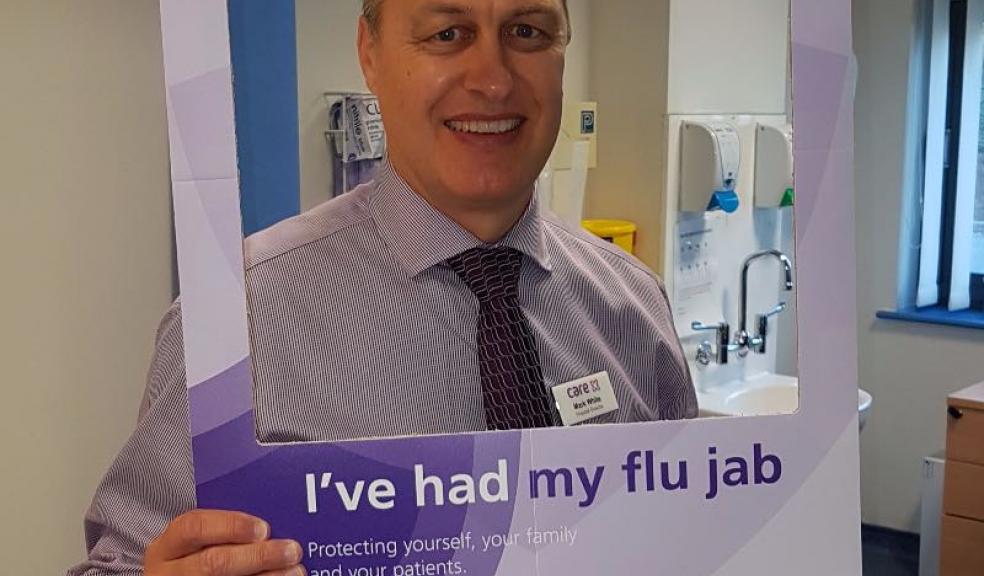 Mark White, Hospital Director at Peninsula NHS Treatment Centre, leads the way after being vaccinated against flu. All 180 members of staff at Peninsula have been offered free flu jabs.