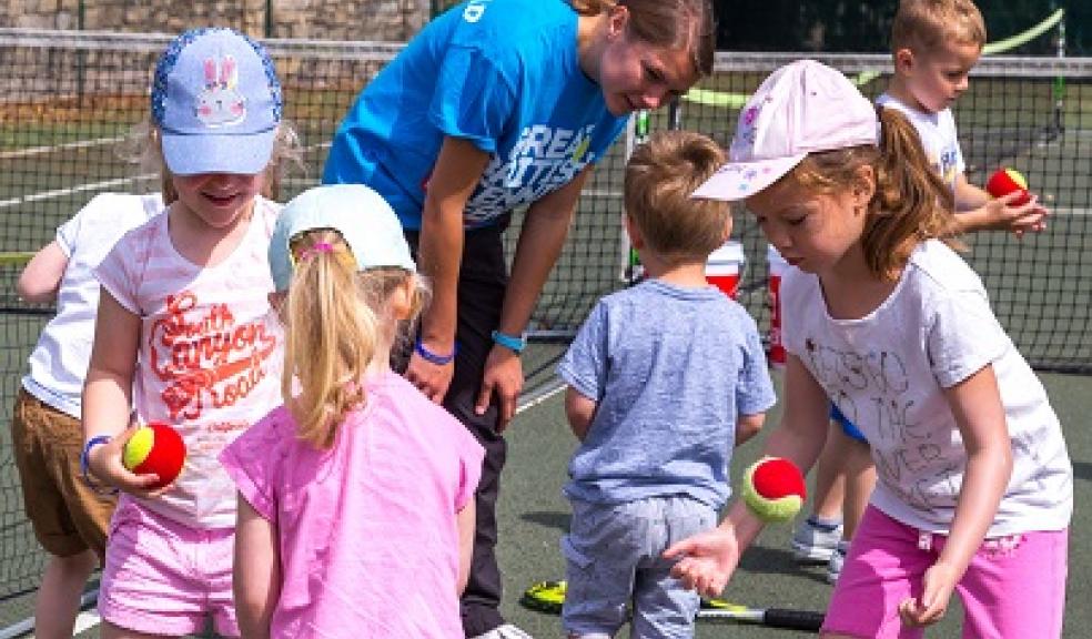 Tennis coach and children enjoying a Great British Tennis Weekend