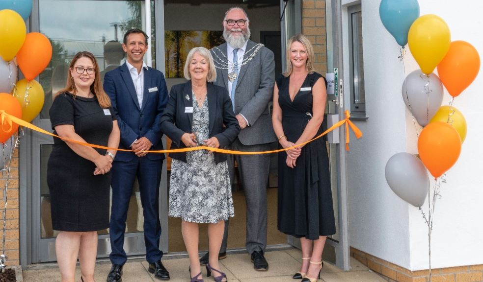 Dame Mary Perkins cutting the ribbon at the grand opening, with Cllr Penberthy and specialist consultant Mr Nick Edmeades