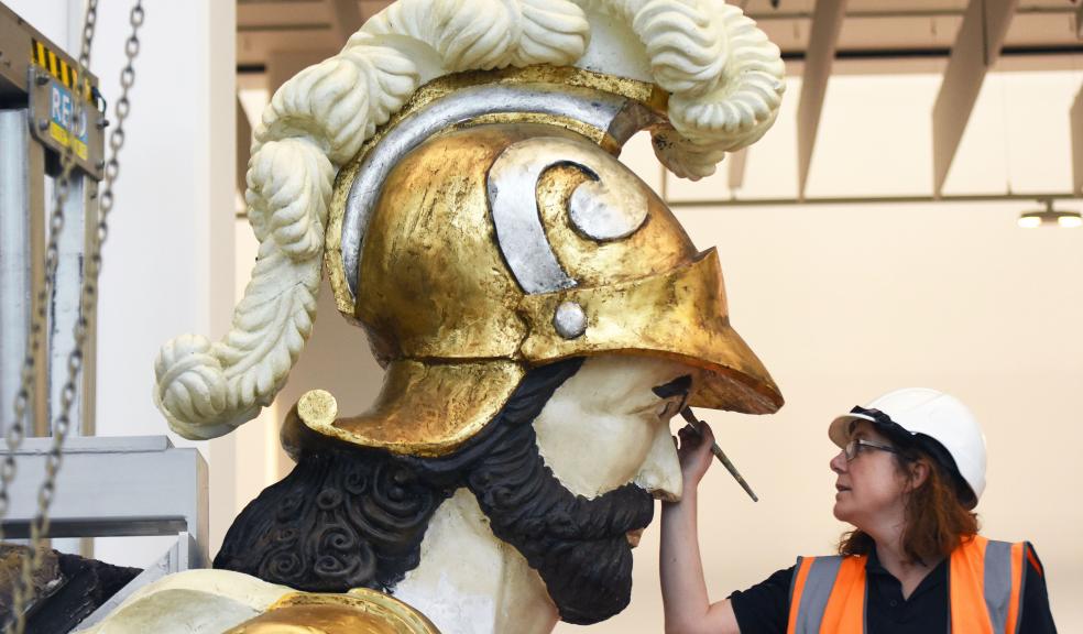 HMS Definance is touched up by a conservator at The Box Plymouth. Photo Credit Wayne Perry.