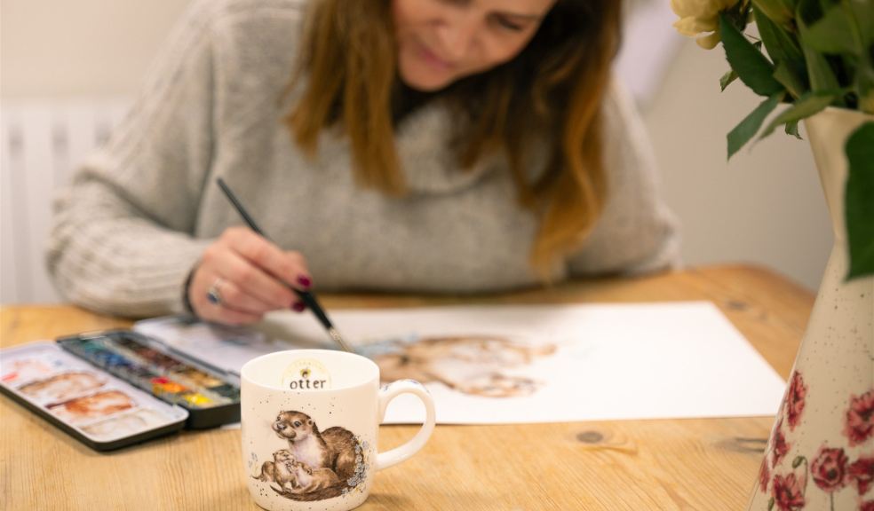 Designer working on artwork for celebratory mug