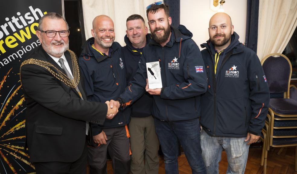 Illusion Fireworks receiving their trophy from Lord Mayor of Plymouth, Councillor Sam Davey. Photo: Plymouth City Council