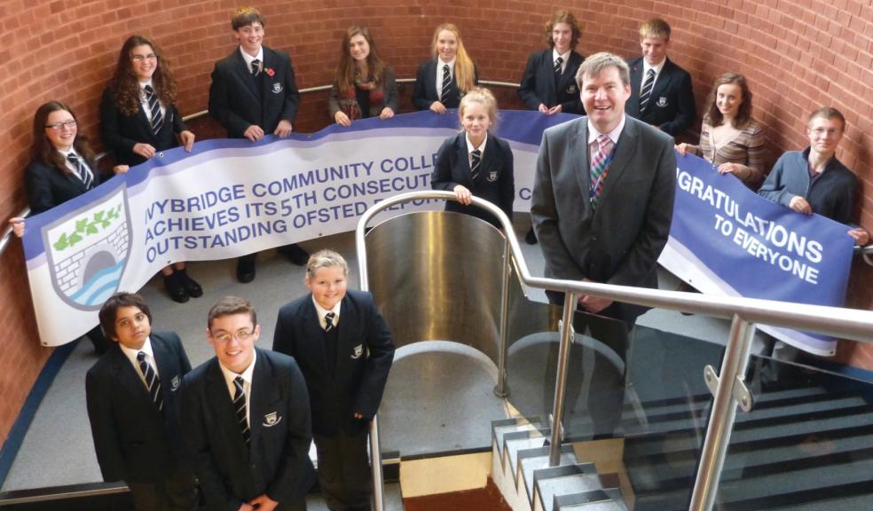 Ivybridge Community College Principal Rob Haring (centre) celebrating the college’s sixth consecutive outstanding Ofsted rating with students