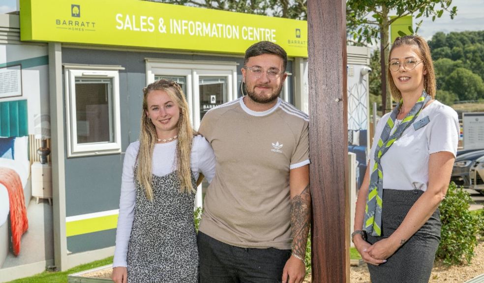 Primary school teacher Chloe Nicholas and her partner Finley with Barratt Homes sales adviser Chloe Toomey.
