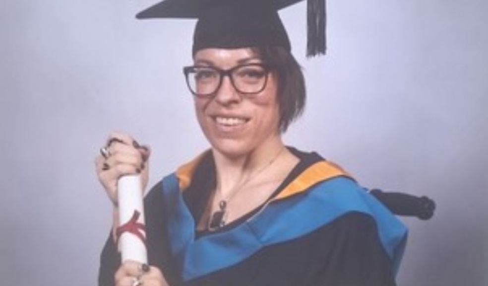 Honiton woman has proved she’s truly First class Jen Statterley in graduation outfit holding a scroll