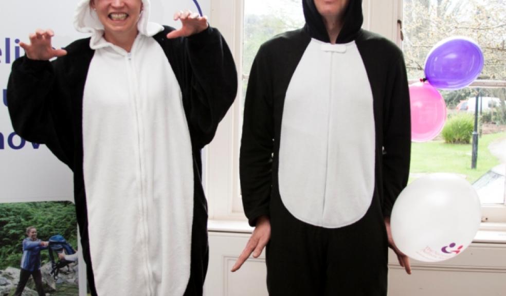 Deborah Stevenson and Steve Lawson in their onesies