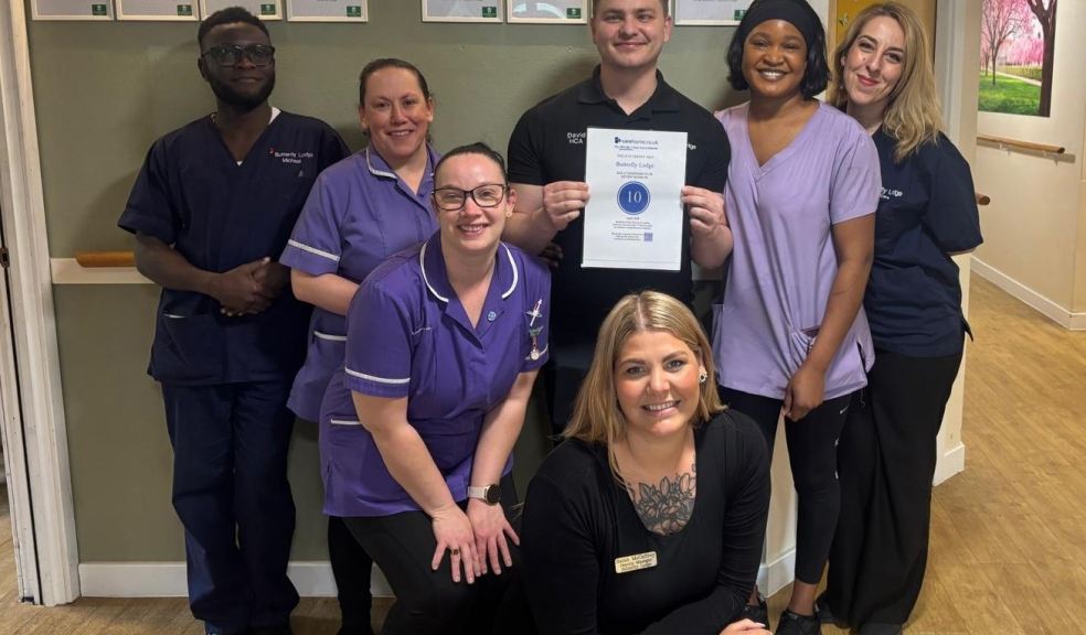 Butterfly Lodge team members with their top score certificate