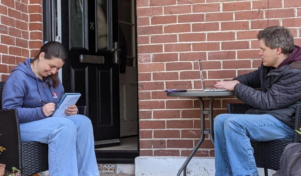Hollie Thayer Read and Thomas Janman working outside