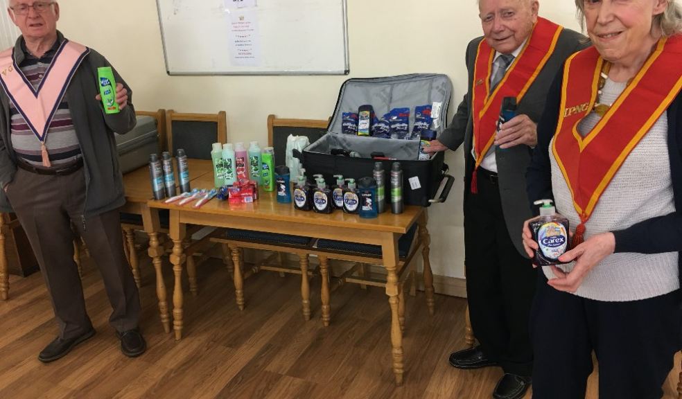L to R: Bro. Michael Harper VG PPGM, Bro. Michael O’Leary NG and Sis. Jenny Holmes PPGM packing some of the purchased items ready for delivery