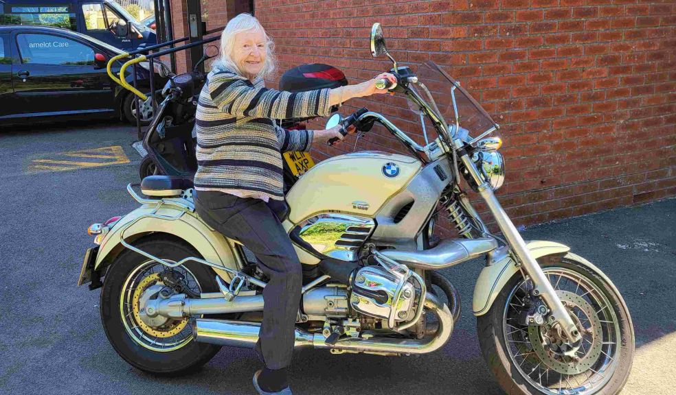 Molly Coyne on the motorbike, Butterfly Lodge