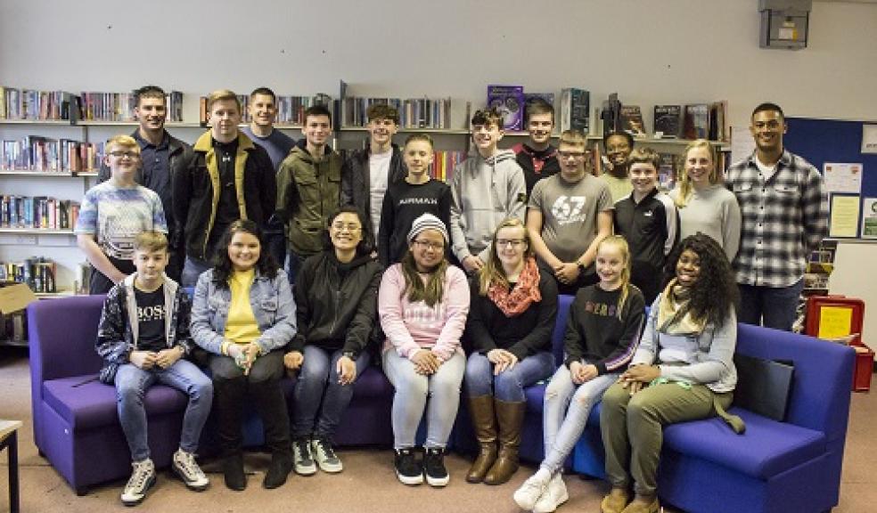 Photo caption: Plympton Academy students with their visitors from USS Gravely.