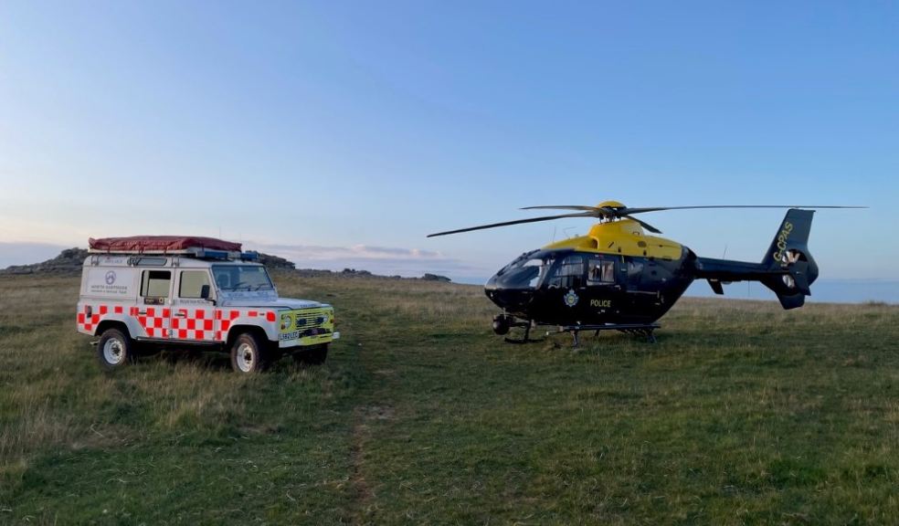 A North Dartmoor Search and Rescue Team Land Rover and a police helicopter.