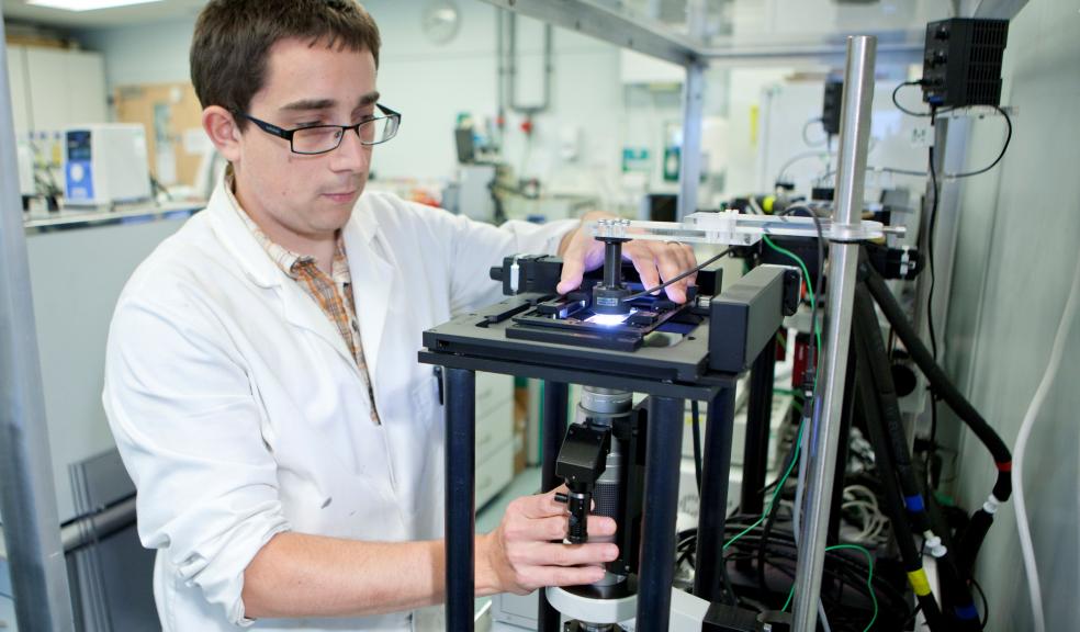 Dr Oliver Tills with the bio-imaging device