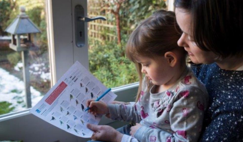 Photo Credit: Mother and her daughter counting birds in their garden, by Eleanor Bentall (rspb-images.com)