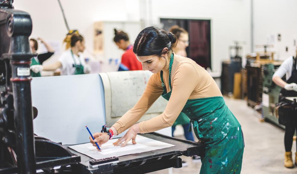 Plymouth College of Art student in printing studio.