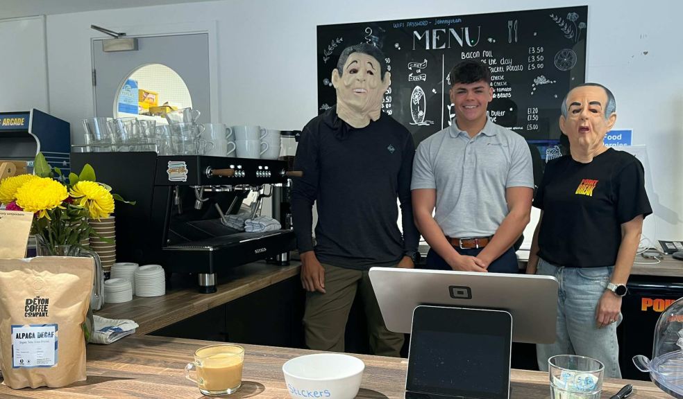 Callum Thompson from Ignition (centre), with Rob Goodger (l) and Jodie Goodger (r) from Point Break café wearing iconic US Ex Presidents masks featured in the 90’s cult surfing movie, Point Break.