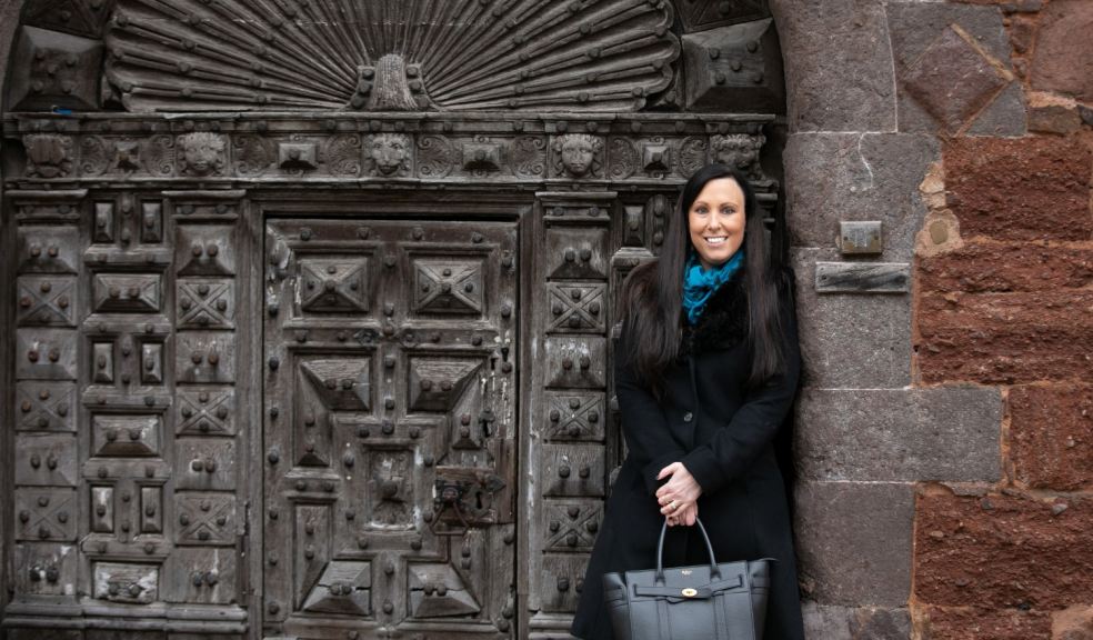 Rachel Buckley from The Family Law Company Family lawyer standing in front of gate