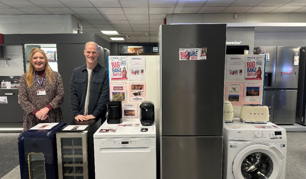 Rowcroft’s Corporate Fundraiser Lisa Whittaker with Tristan Cook, Director of Sparkworld, at the Sparkworld kitchen showroom.