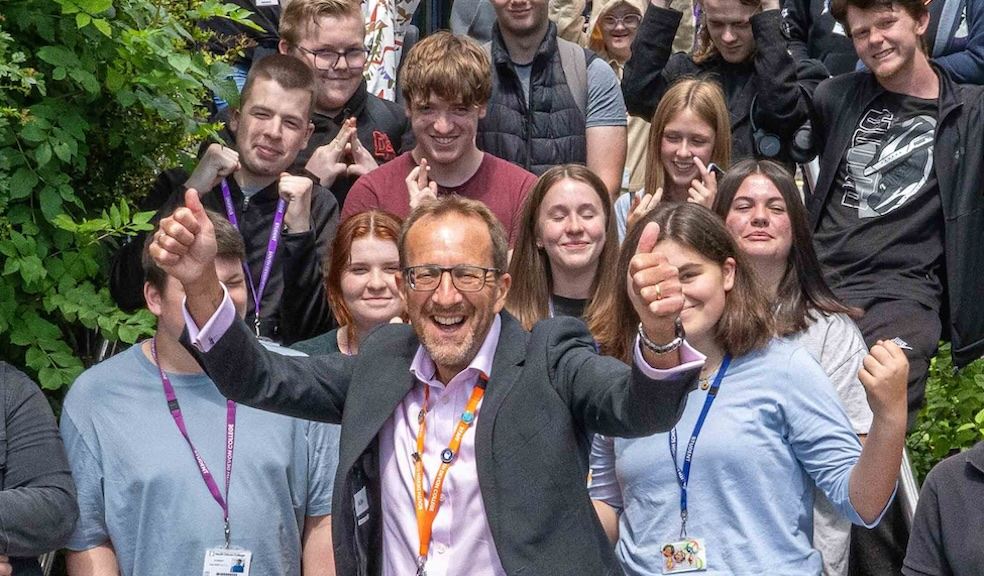 Laurence Frewin, Principal and CEO of South Devon College celebrates recent Ofsted report with students.
