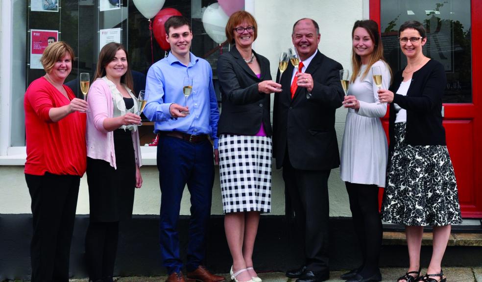 Sally Reed and her team toast the new merger at their Launceston office with Vince Edwards, Managing Partner of HWSW.