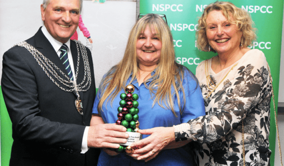 Paula Stebbing from David May Motors is presented with the award for 'Best Decorated Tree' from the Deputy Lord Mayor, and Deputy Lady Mayoress of Plymouth. Credit Nic Randall. Photo: Nic Randall