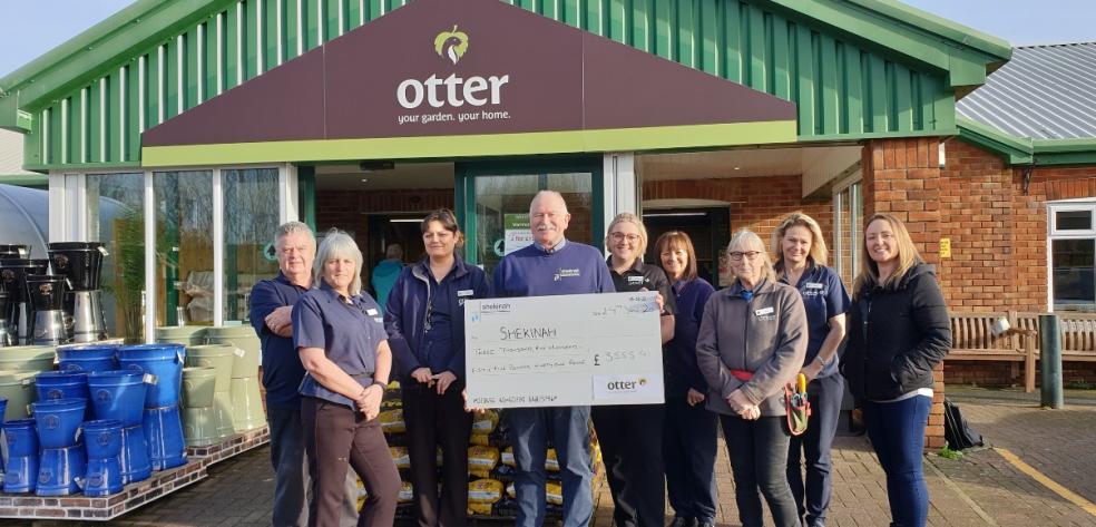 Andy Kebby of Shekinah (centre) with team members from Otter Garden Centre Plymouth