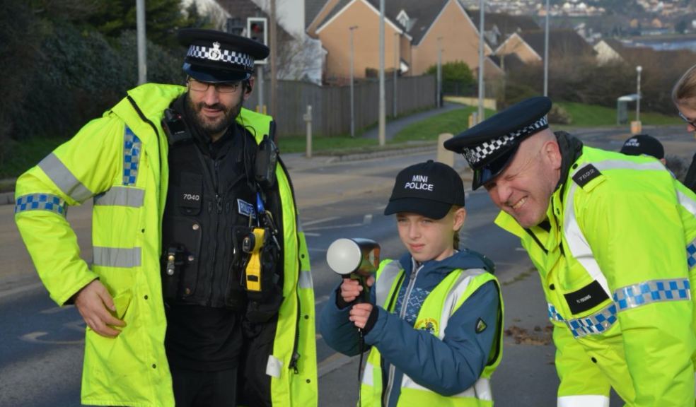 Two policeman with child and traffic speed gun
